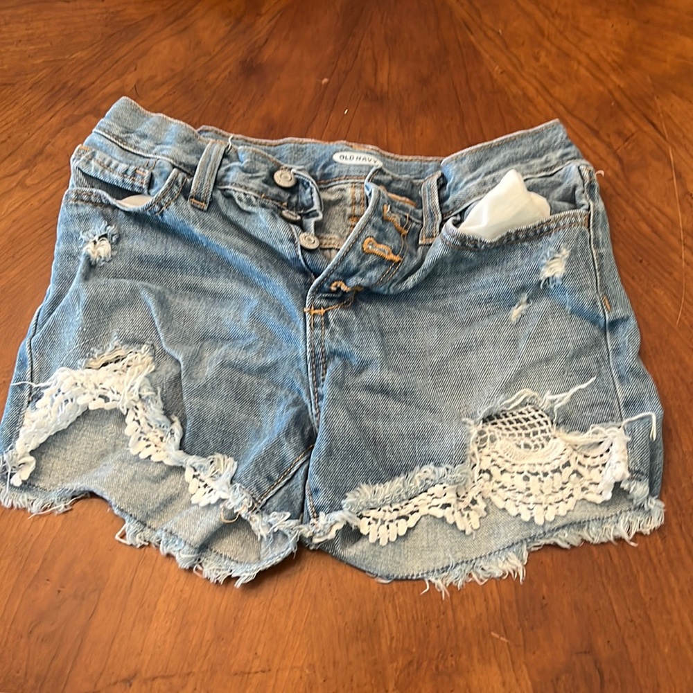 Jean shorts from old navy. Adjustable straps. Light blue with four buttons.